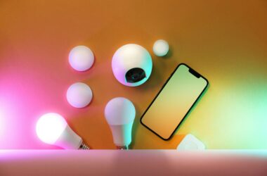 Smartphone beside smart light bulbs representing Matter smart home setup